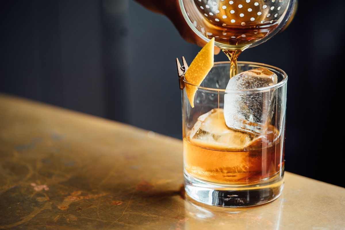 Closeup Glass with Alcohol in Cocktail Bar